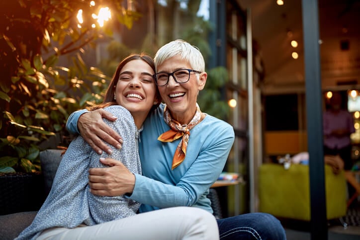 mom hugging daughter