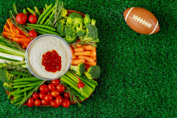 plate of vegetable and football