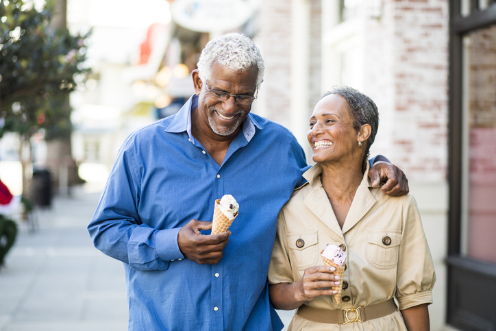 A senior african american couple enjoy an evening on the town with ice cream