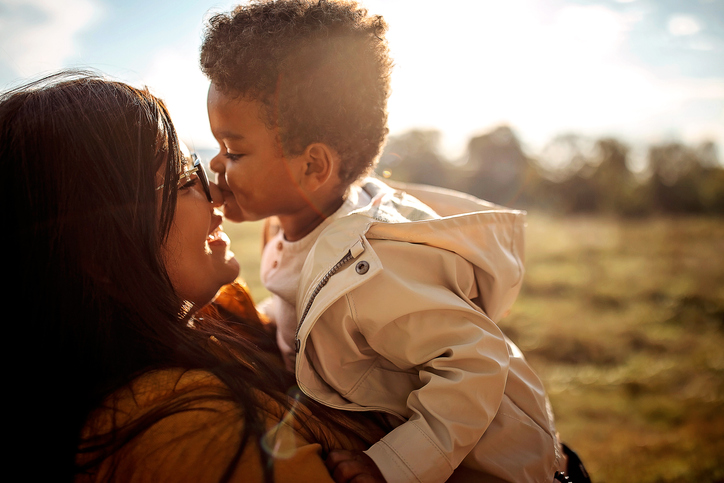 Multi-ethic mother and son spending time together outdoors