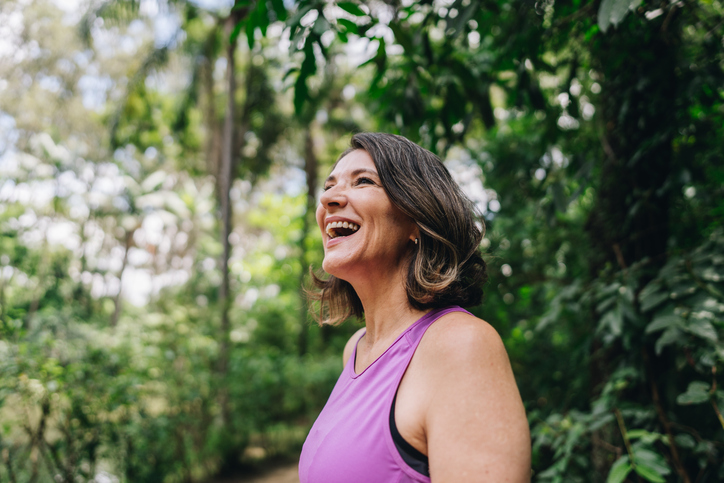 Mature woman looking around on the public park